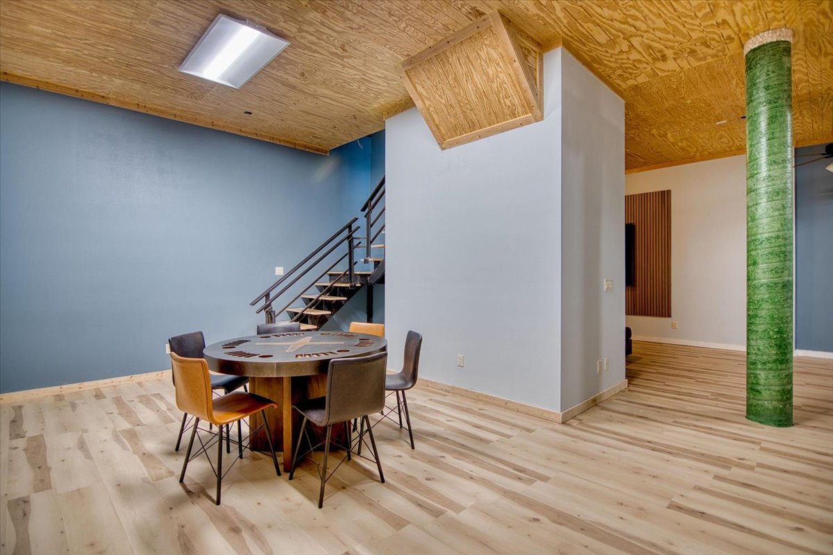 301 Blessing Ranch Road Liberty Hill, TX 78642 - Photo 29 of 40 a view of a dining room with furniture and wooden floor