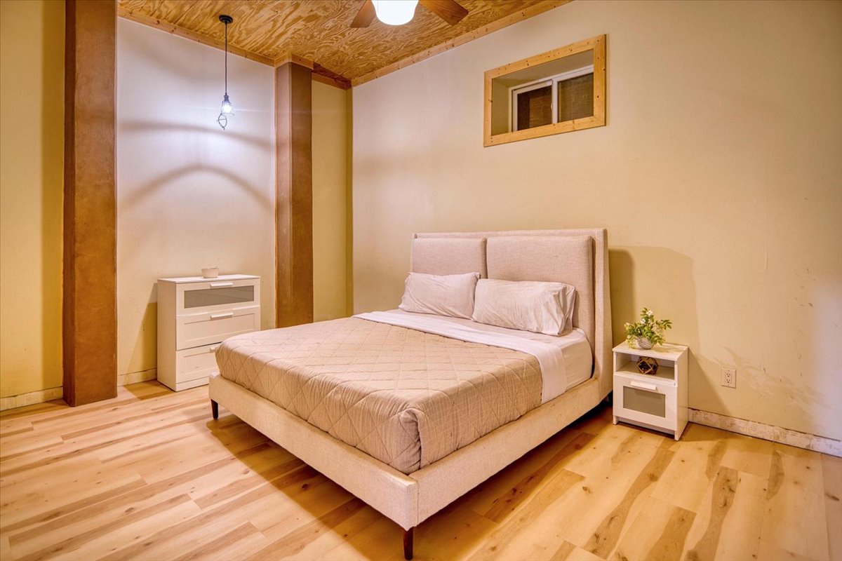 301 Blessing Ranch Road Liberty Hill, TX 78642 - Photo 34 of 40 a bedroom with a bed and a cabinets