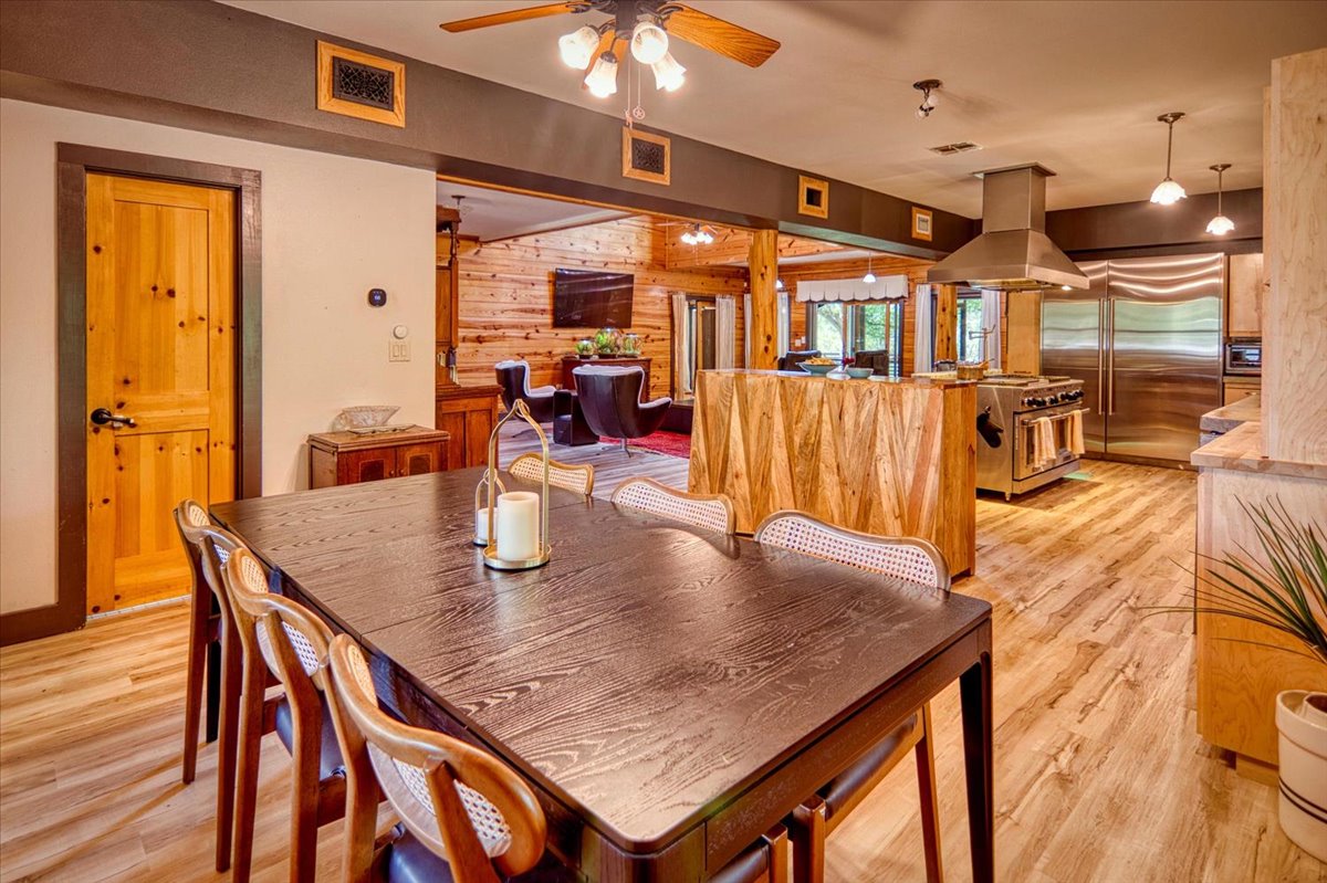 301 Blessing Ranch Road Liberty Hill, TX 78642 - Photo 7 of 40 a view of a dining room with furniture and a chandelier