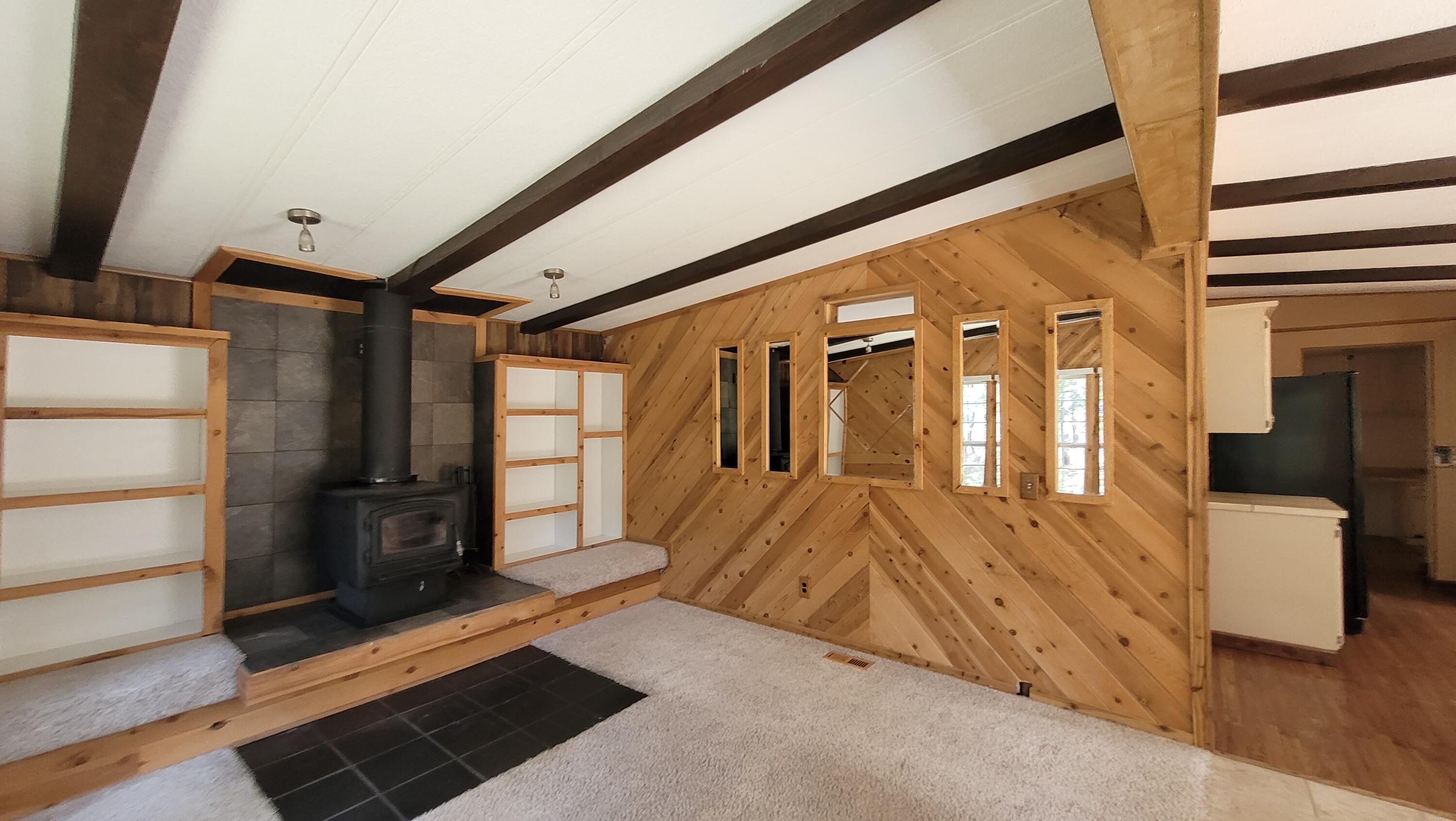 19724 Buck Canyon Road Bend, OR 97702 - Photo 6 of 38 Family room with 2nd wood stove.