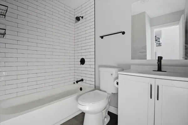 a kitchen with white cabinets stainless steel appliances and a sink