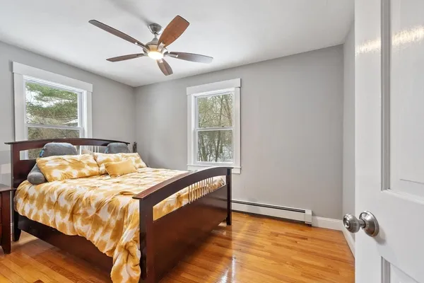 a bedroom with a bed and window