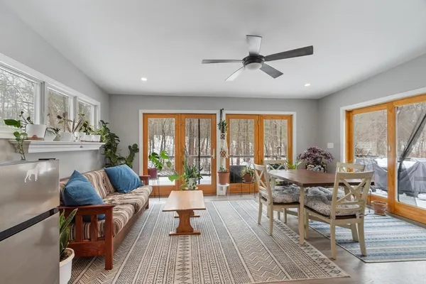 a living room with furniture and a large window