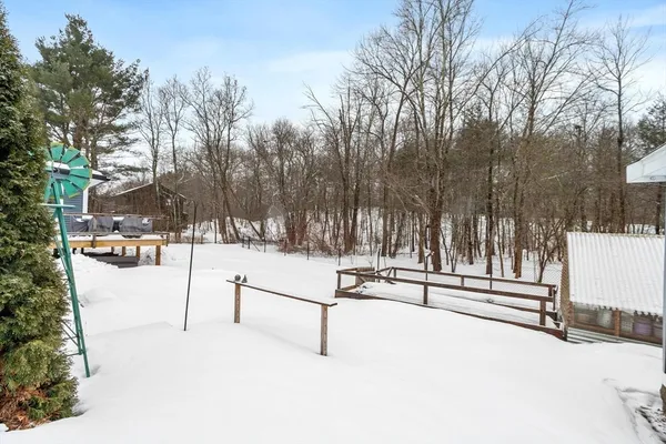 a view of a patio with couches table and chairs and potted plants