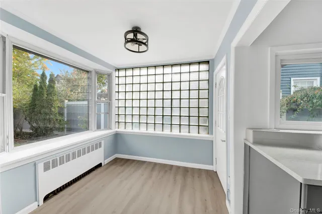 a view of an empty room with a window