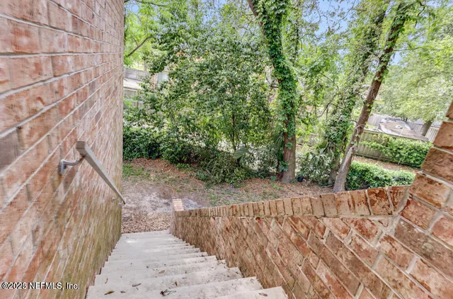 a view of a pathway with a yard