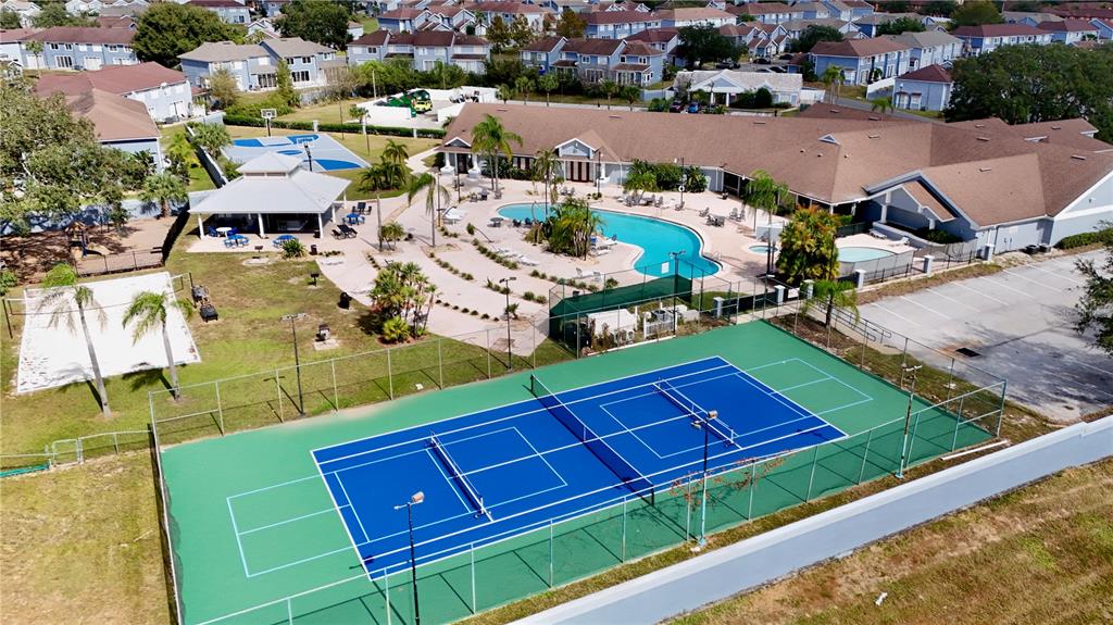 669 Caribbean Drive, Unit B Davenport, FL 33897 - Photo 13 of 15 an aerial view of multiple houses with yard