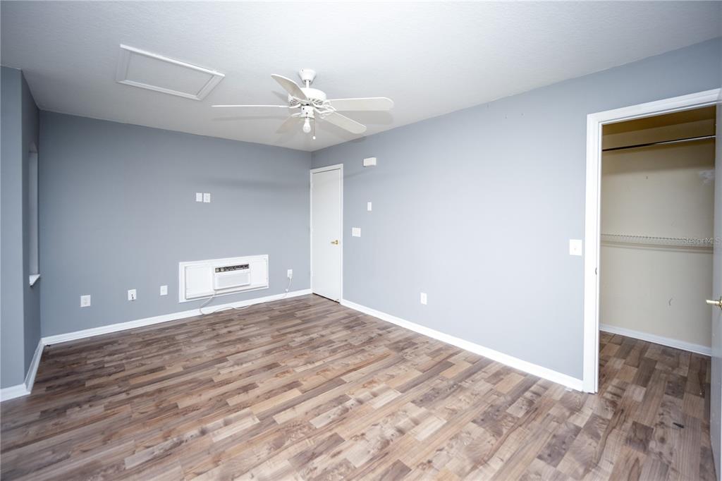 669 Caribbean Drive, Unit B Davenport, FL 33897 - Photo 2 of 15 wooden floor in an empty room