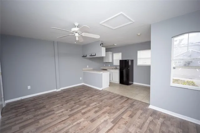 a view of a kitchen with a sink and a window