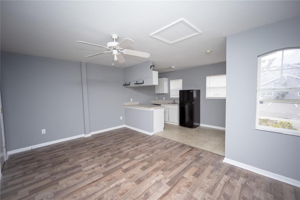 669 Caribbean Drive, Unit B Davenport, FL 33897 - Photo 4 of 15 a view of a kitchen with a sink and a window