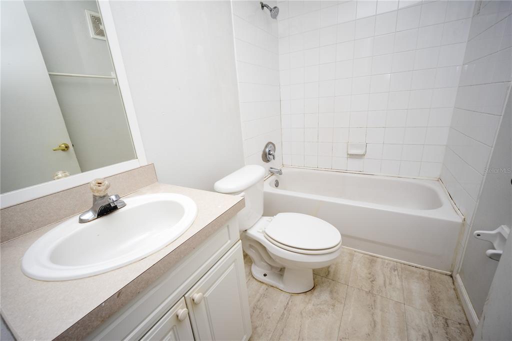 669 Caribbean Drive, Unit B Davenport, FL 33897 - Photo 6 of 15 a bathroom with a sink and a toilet