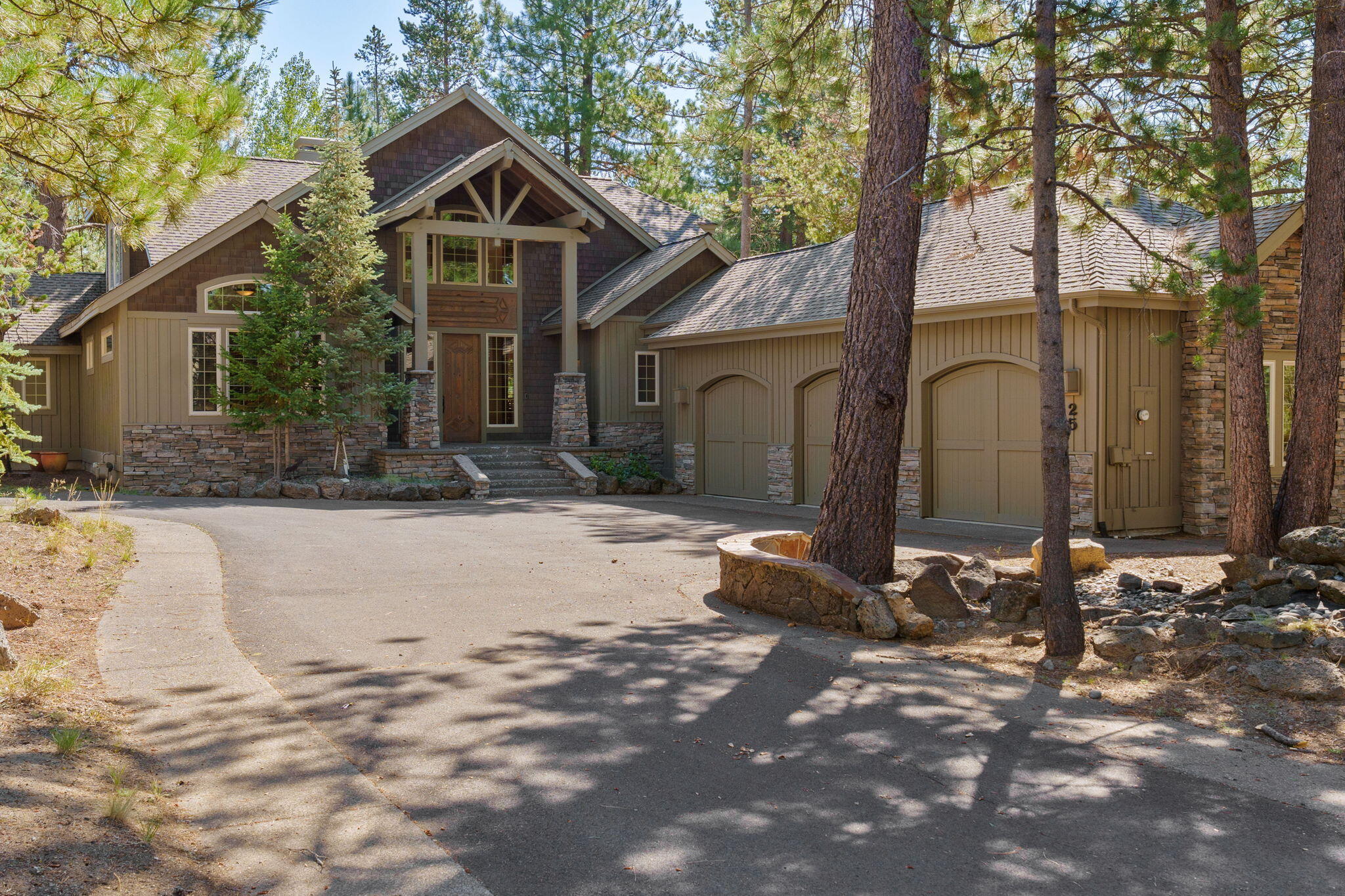 58026 Kinglet Road Sunriver, OR 97707 - Photo 3 of 39 a front view of a house with a yard