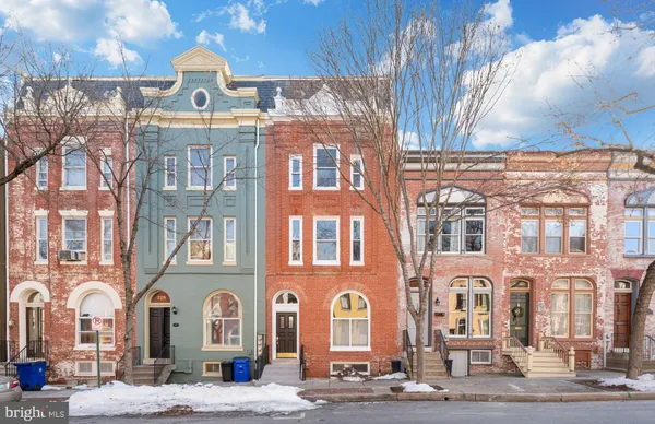 a front view of a building with street view