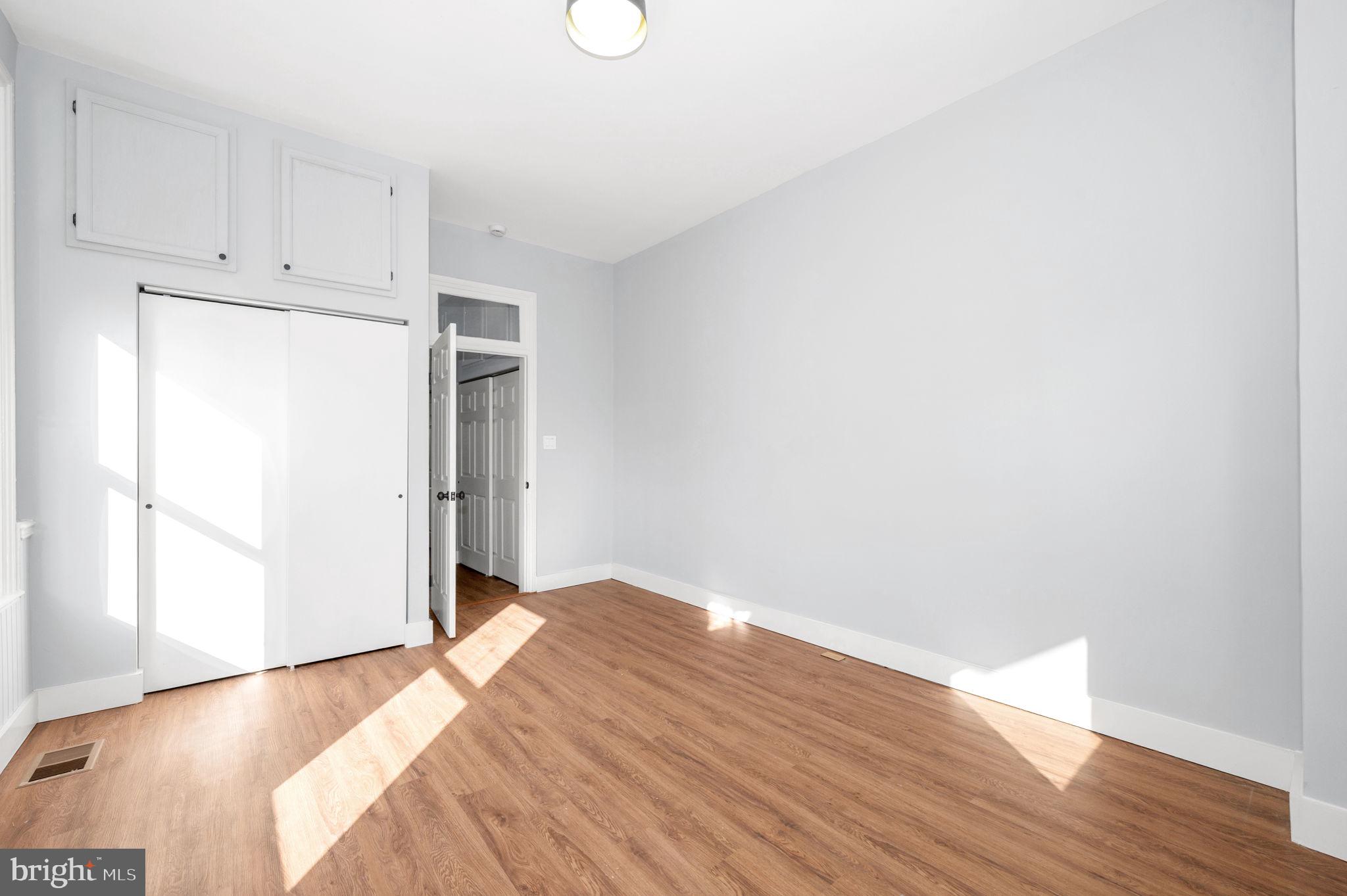230 South Market Street, Unit 1 Frederick, MD 21701 - Photo 11 of 27 a view of empty room with wooden floor