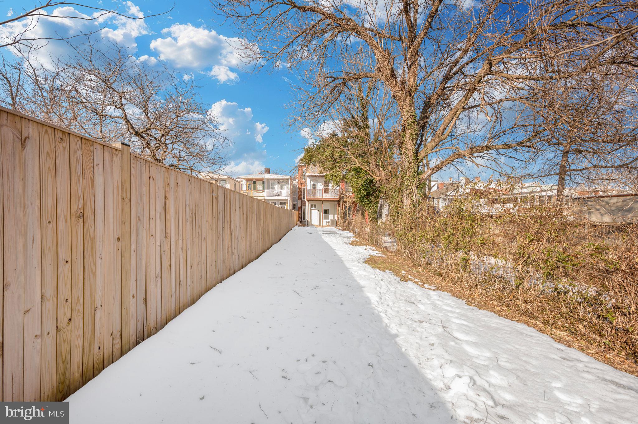 230 South Market Street, Unit 1 Frederick, MD 21701 - Photo 16 of 27 a view of a backyard with wooden fence