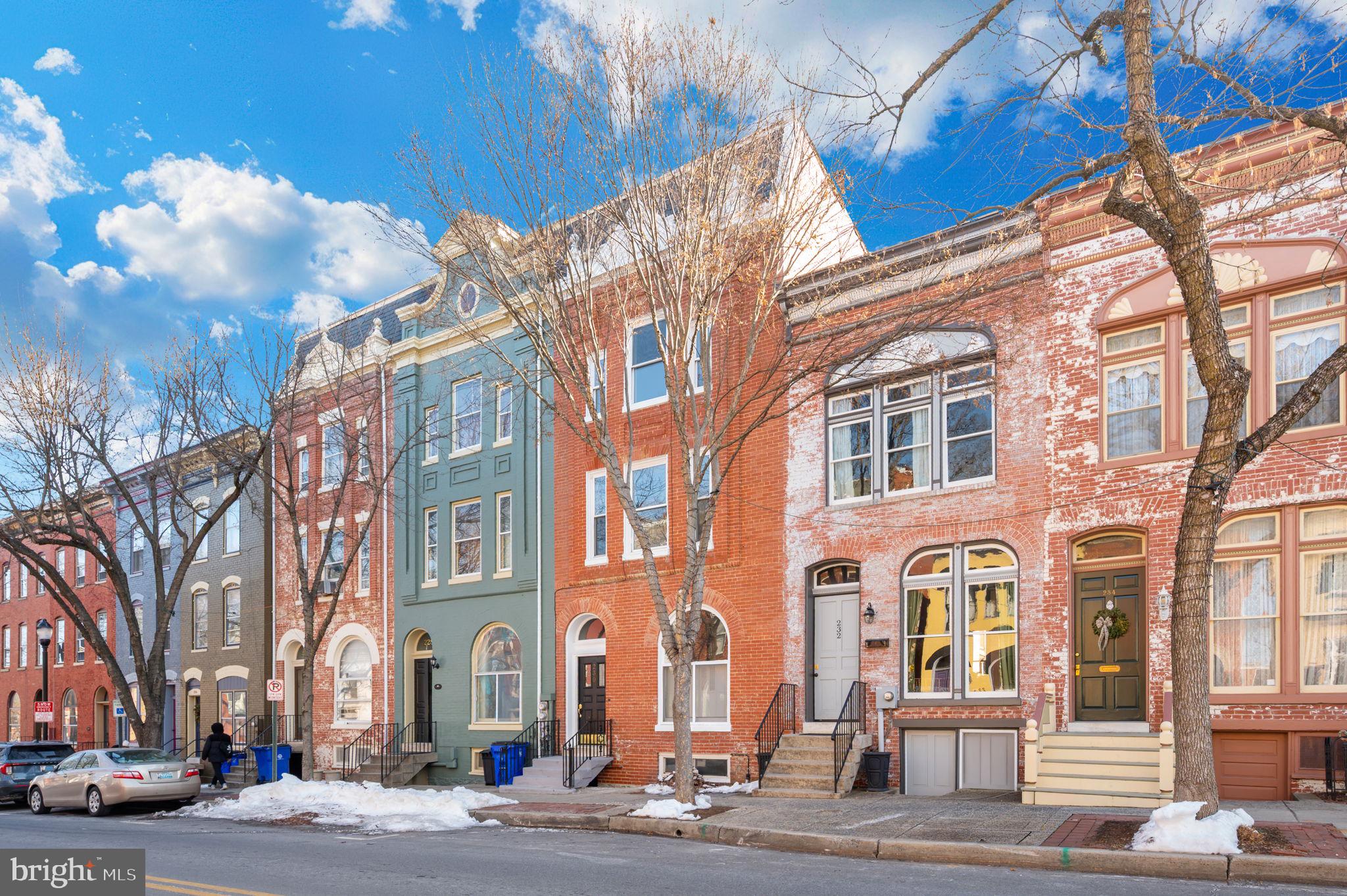 230 South Market Street, Unit 1 Frederick, MD 21701 - Photo 2 of 27 a city street lined with buildings and trees