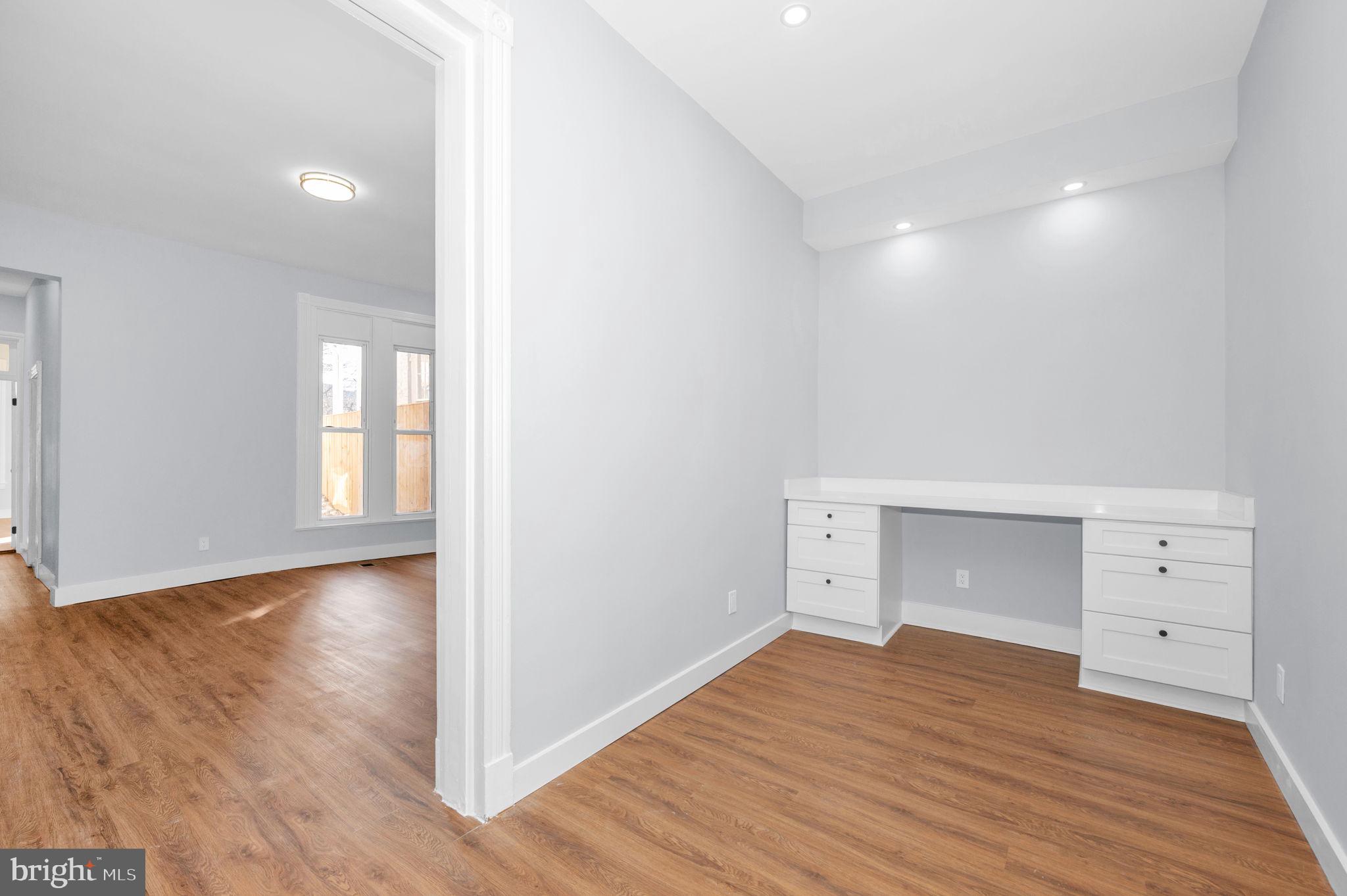 230 South Market Street, Unit 1 Frederick, MD 21701 - Photo 5 of 27 a view of empty room with wooden floor