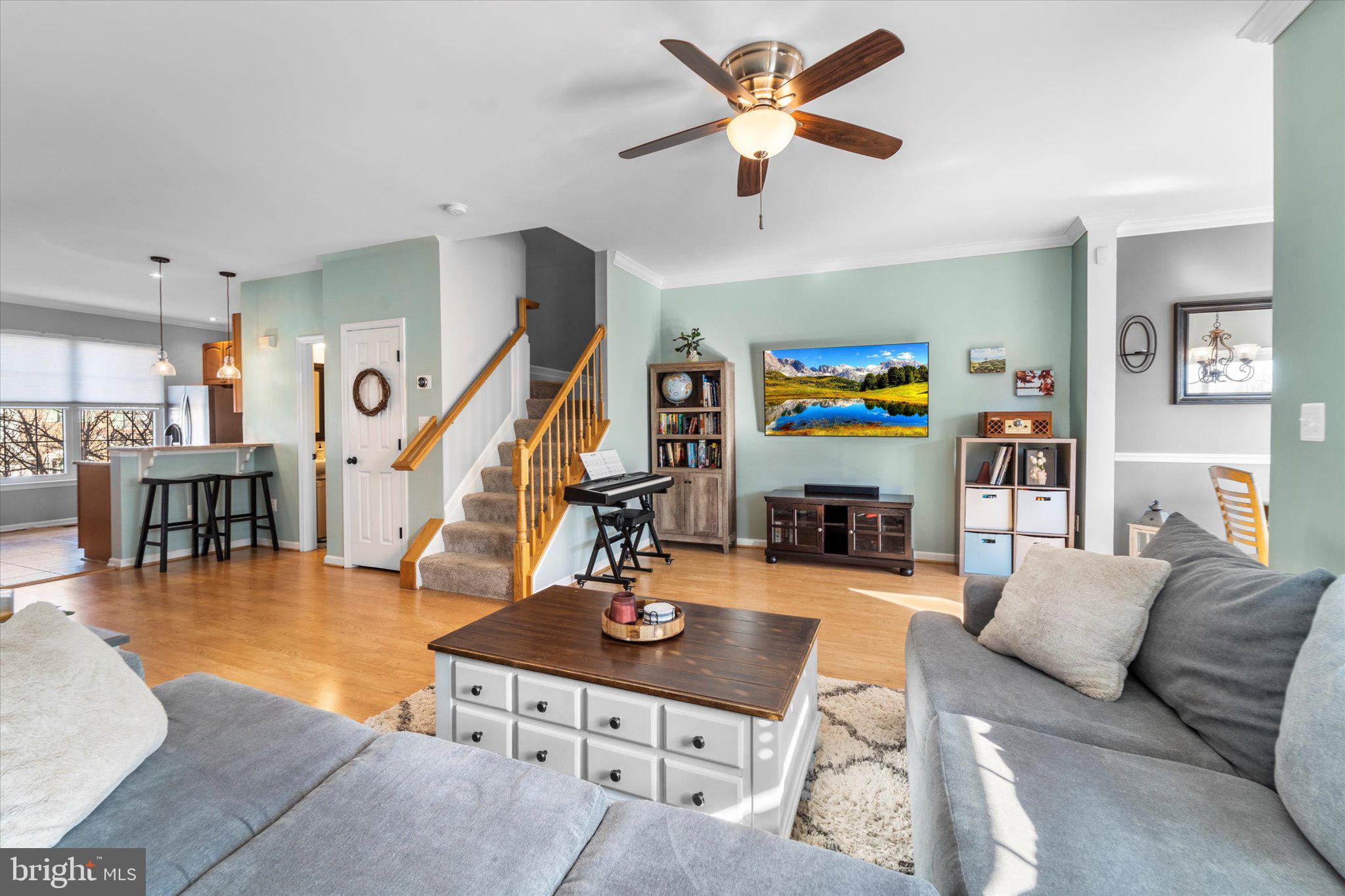21070 Tyler Too Terrace Ashburn, VA 20147 - Photo 19 of 66 a living room with furniture and kitchen view