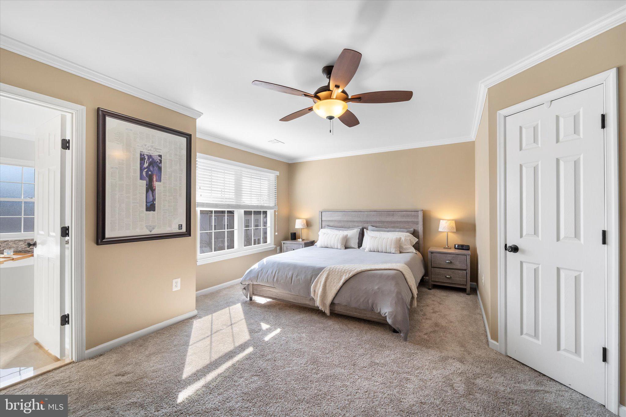 21070 Tyler Too Terrace Ashburn, VA 20147 - Photo 25 of 66 a spacious bedroom with a bed and a window