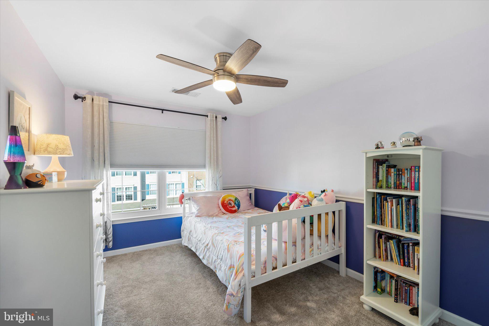 21070 Tyler Too Terrace Ashburn, VA 20147 - Photo 30 of 66 a bedroom with furniture window and book shelf