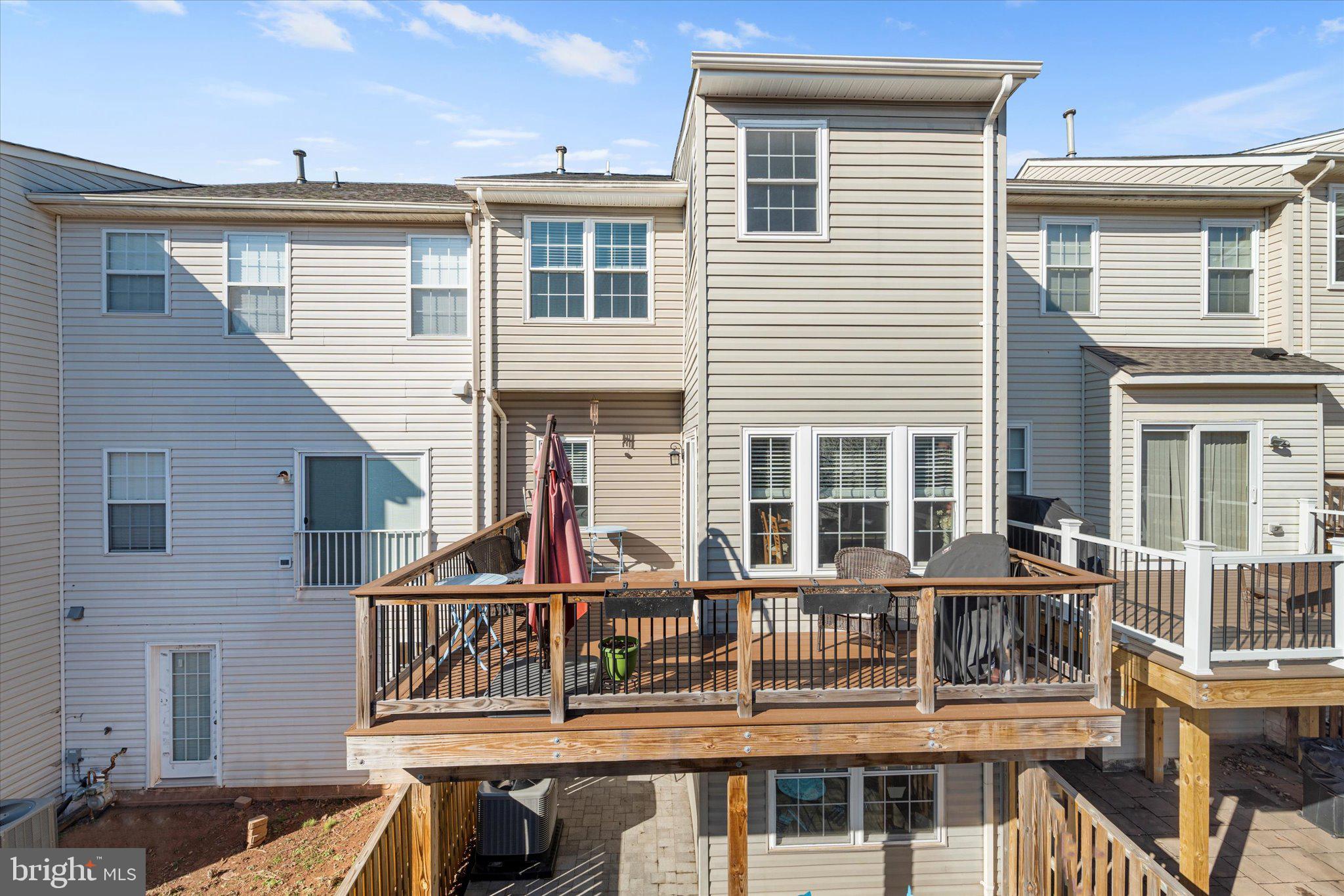 21070 Tyler Too Terrace Ashburn, VA 20147 - Photo 35 of 66 a front view of a house with a balcony
