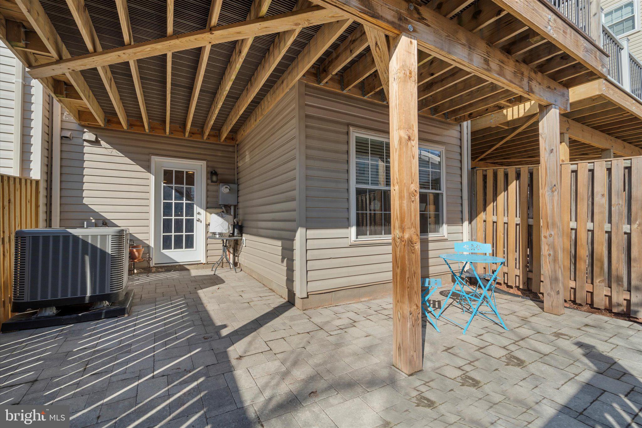 21070 Tyler Too Terrace Ashburn, VA 20147 - Photo 37 of 66 a view of house with wooden floor and wooden fence