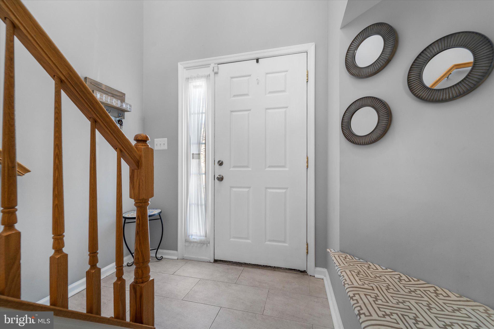 21070 Tyler Too Terrace Ashburn, VA 20147 - Photo 5 of 66 a view of an entryway with wooden floor
