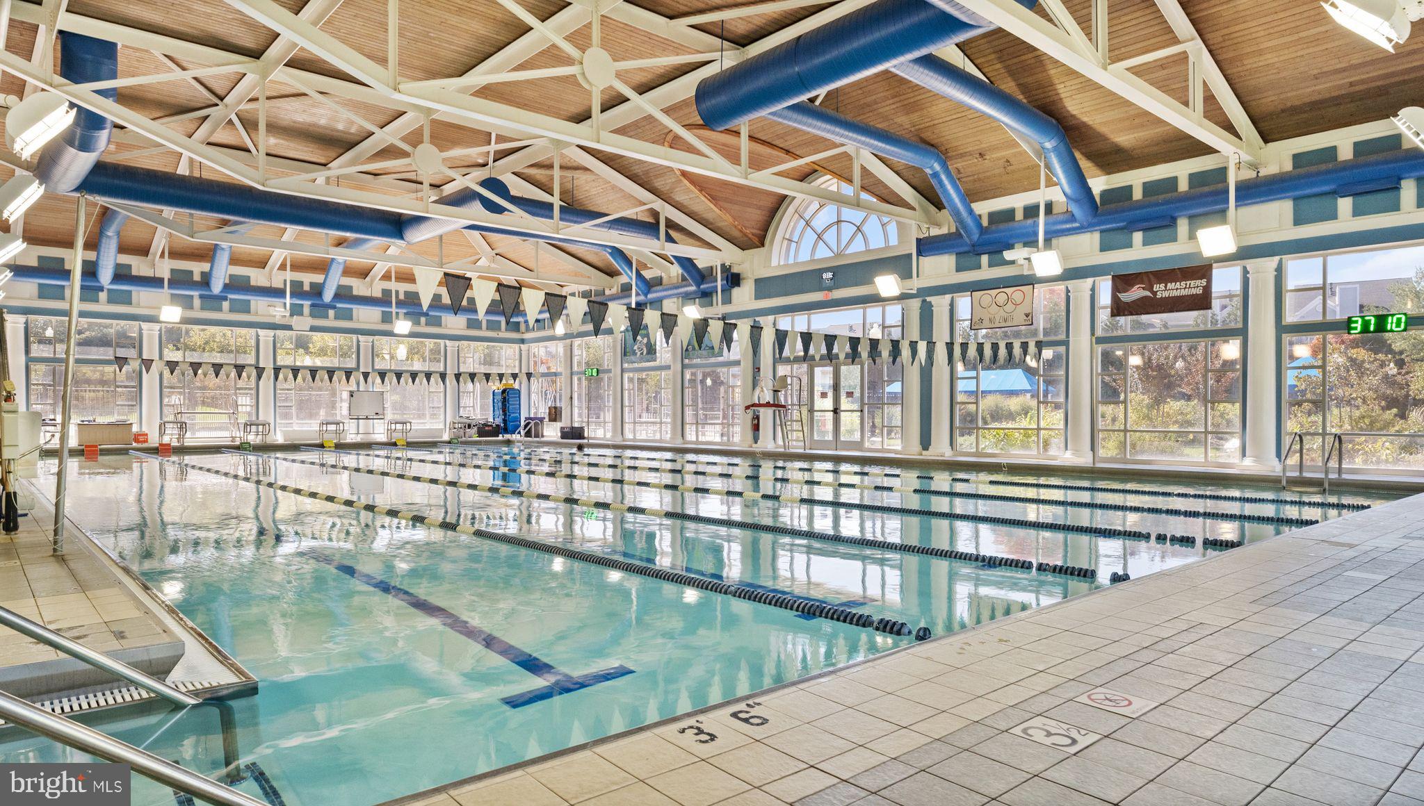 21070 Tyler Too Terrace Ashburn, VA 20147 - Photo 56 of 66 a view of a swimming pool with a outdoor seating