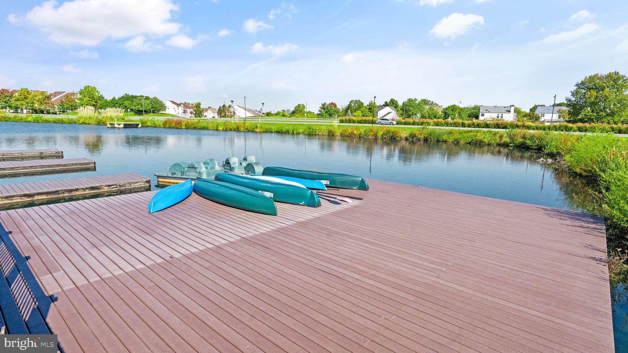 21070 Tyler Too Terrace Ashburn, VA 20147 - Photo 60 of 66 a view of a lake with houses with outdoor space and lake view