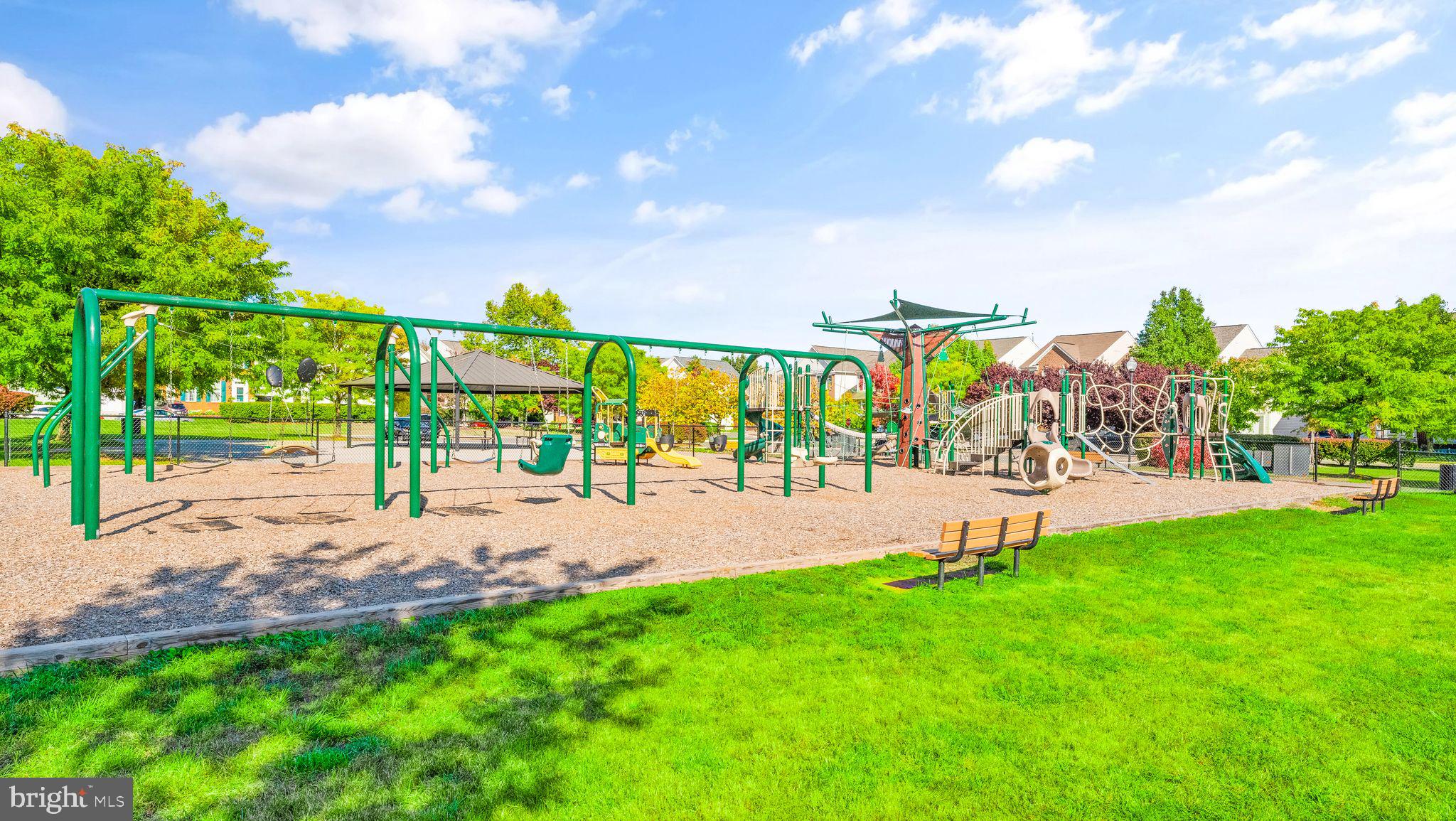 21070 Tyler Too Terrace Ashburn, VA 20147 - Photo 66 of 66 a view of a park with swings and slides