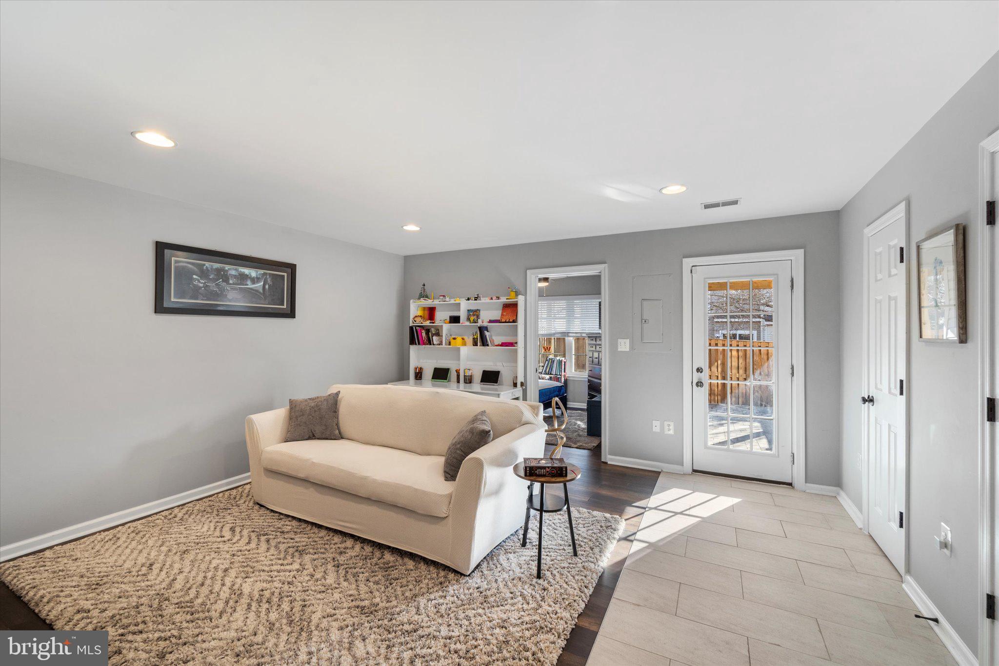 21070 Tyler Too Terrace Ashburn, VA 20147 - Photo 7 of 66 a living room with furniture and a rug