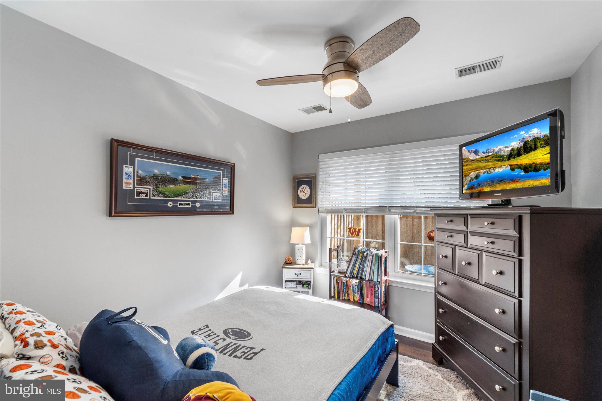 21070 Tyler Too Terrace Ashburn, VA 20147 - Photo 9 of 66 a living room with furniture and a flat screen tv