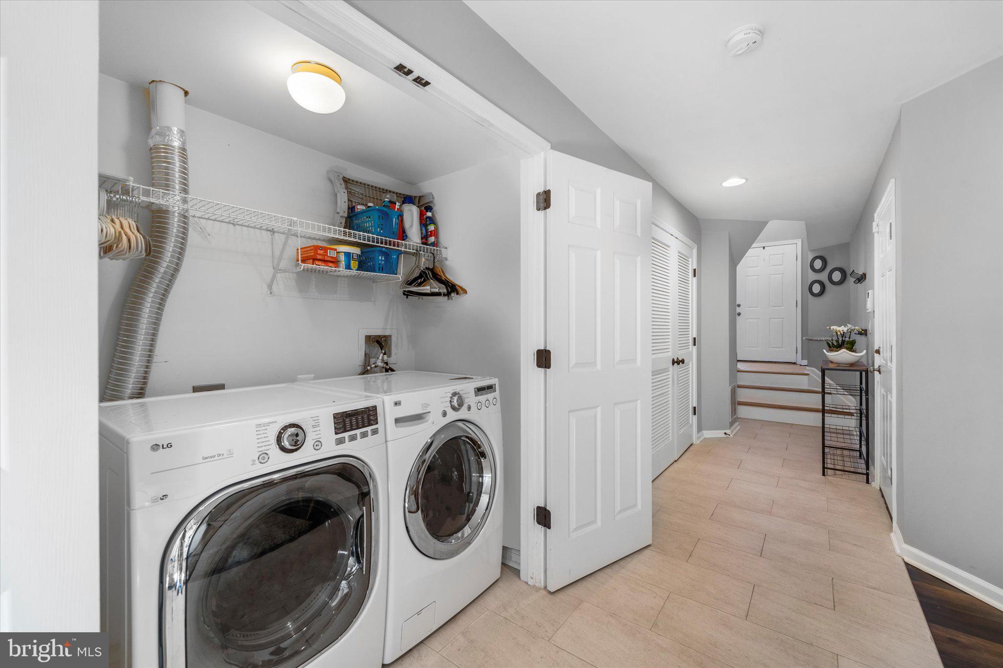 21070 Tyler Too Terrace Ashburn, VA 20147 - Photo 10 of 66 a view of hallway with washer and dryer