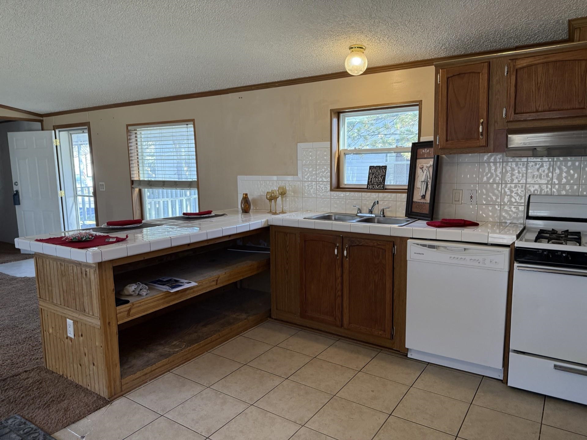 435 32 Road, Unit 227 Clifton, CO 81520 - Photo 6 of 18 a kitchen with a sink and cabinets