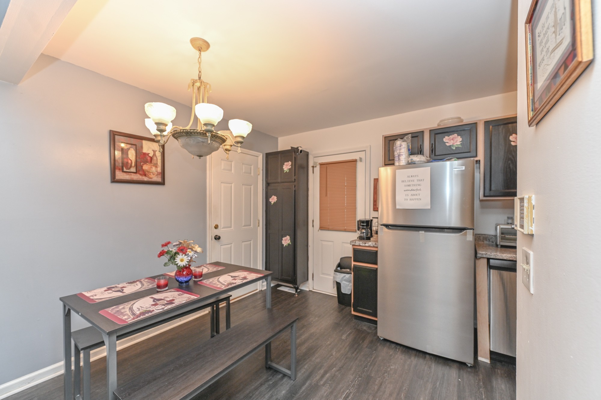 508 Robbie Ann Court Madison, TN 37115 - Photo 21 of 38 a kitchen with stainless steel appliances kitchen island granite countertop a refrigerator a stove and white cabinets with wooden floor