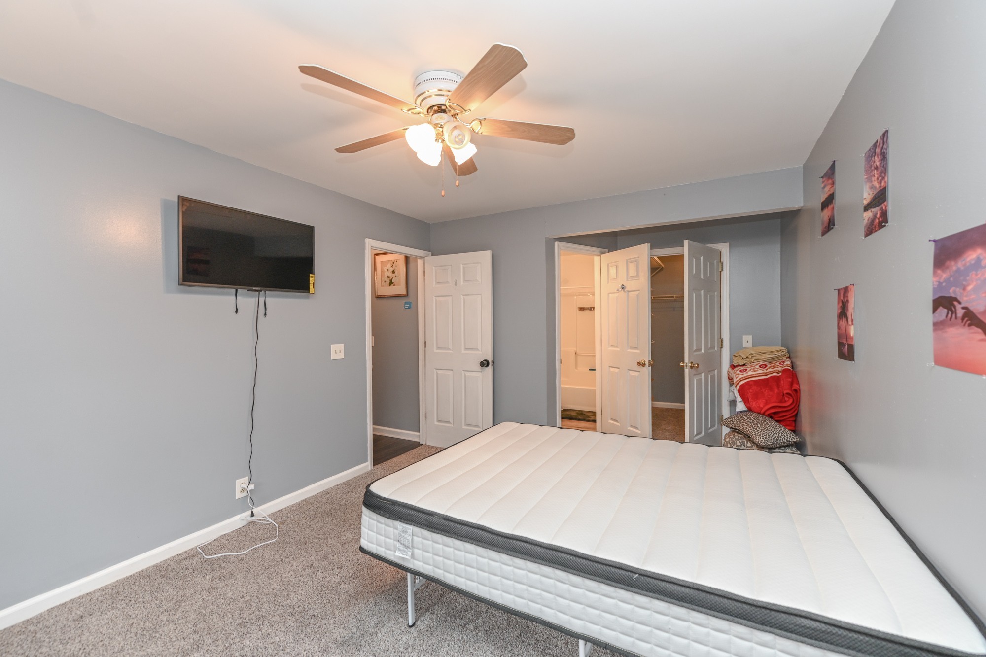 508 Robbie Ann Court Madison, TN 37115 - Photo 27 of 38 a bedroom with a bed and a flat screen tv