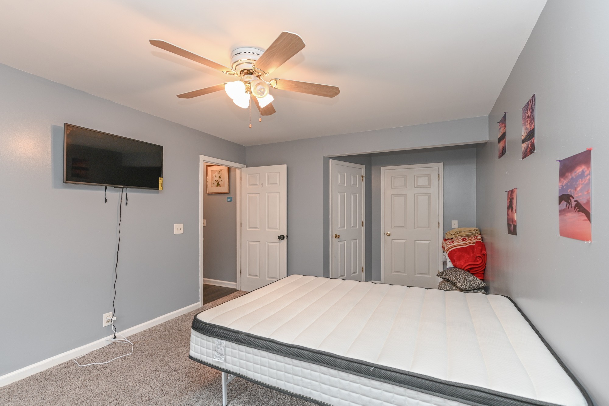 508 Robbie Ann Court Madison, TN 37115 - Photo 31 of 38 a bedroom with a bed and a flat screen tv