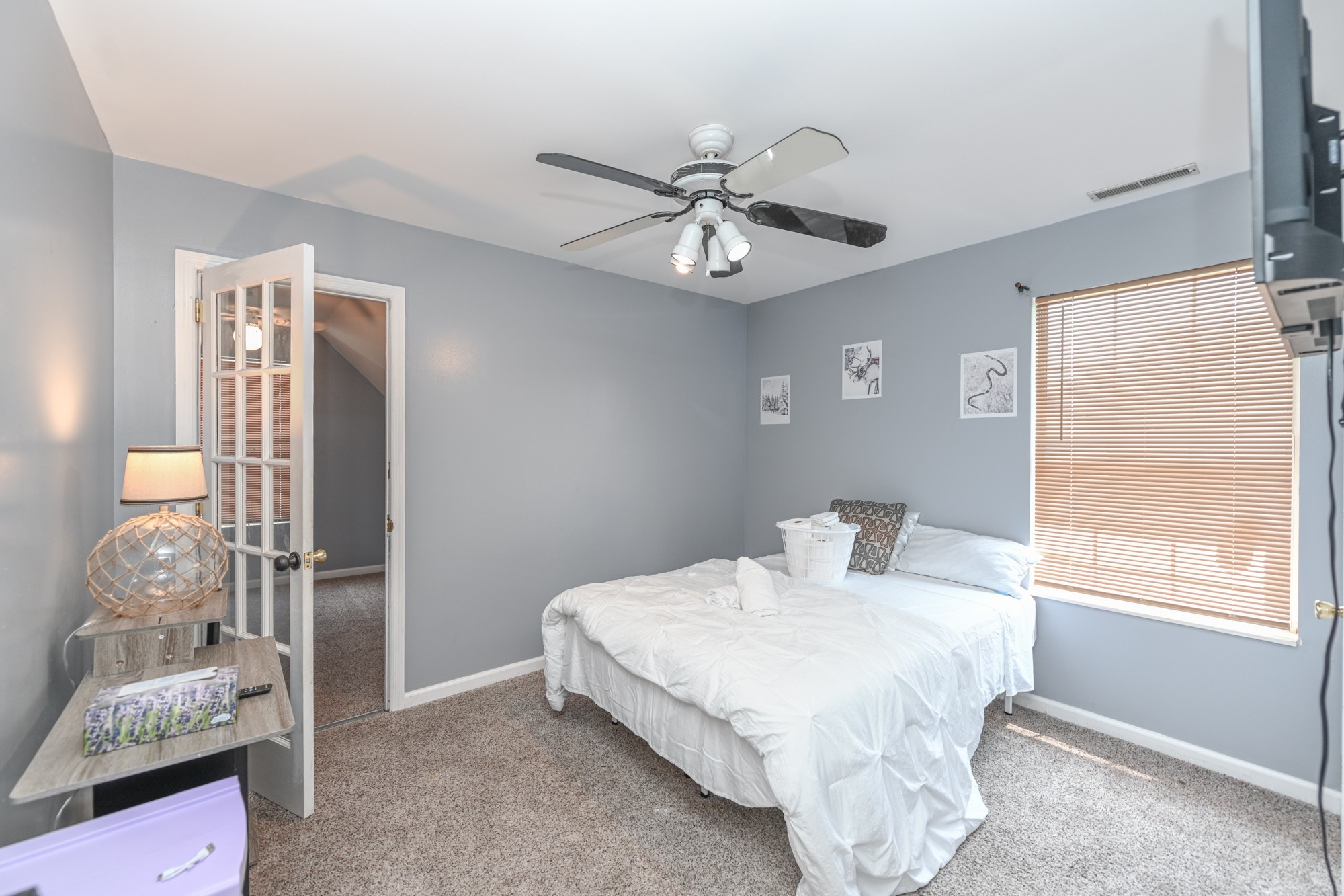 508 Robbie Ann Court Madison, TN 37115 - Photo 36 of 38 a bedroom with a bed ceiling fan and a window