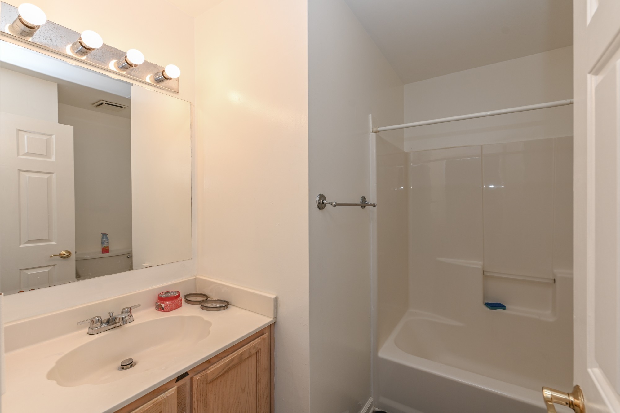 508 Robbie Ann Court Madison, TN 37115 - Photo 38 of 38 a bathroom with a tub sink vanity and mirror