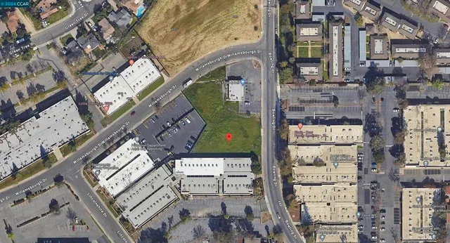 a picture of a glass door with white walls and wooden floor