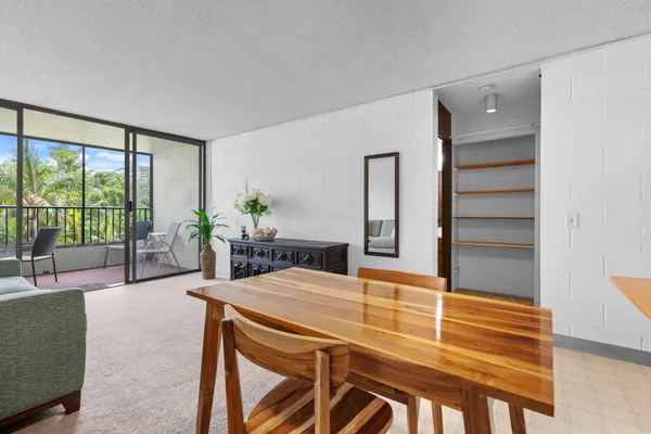 a living room with furniture and large windows