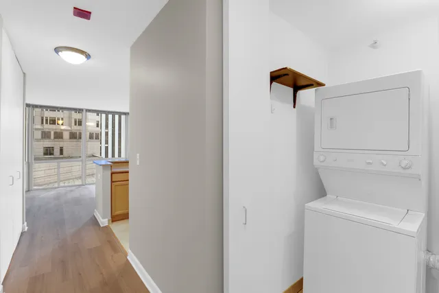 a view of hallway with wooden floor