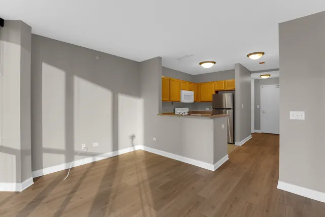 a view of a kitchen cabinets and wooden floor