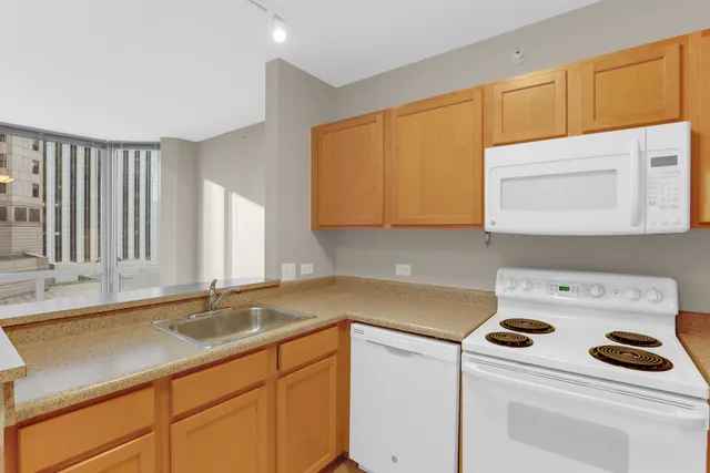 a utility room with sink washer and dryer