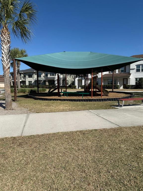 2840 Chantilly Avenue Kissimmee, FL 34741 - Photo 12 of 22 a view of a building with a yard