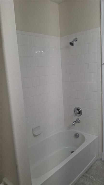 2840 Chantilly Avenue Kissimmee, FL 34741 - Photo 17 of 22 a bathroom with a bathtub