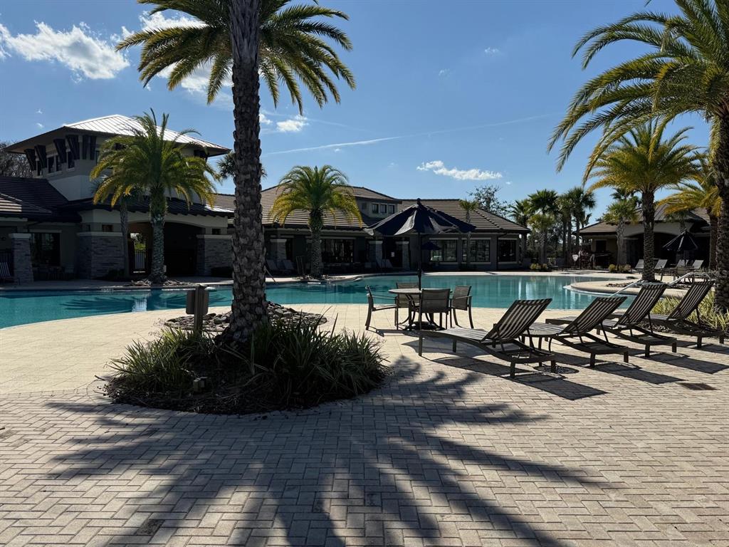 2840 Chantilly Avenue Kissimmee, FL 34741 - Photo 5 of 22 a view of a swimming pool with lounge chair