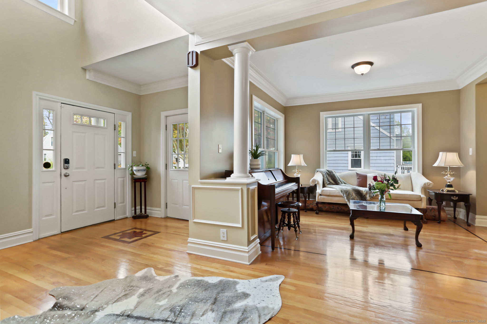 25 Country Road, Unit 25 Fairfield, CT 06824 - Photo 11 of 40 a living room with furniture and a large window