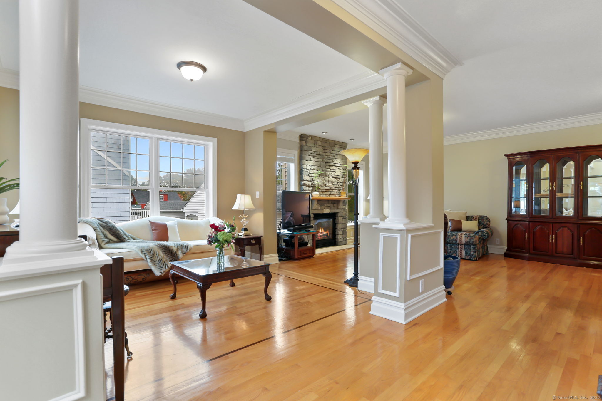 25 Country Road, Unit 25 Fairfield, CT 06824 - Photo 13 of 40 a living room with furniture and large windows
