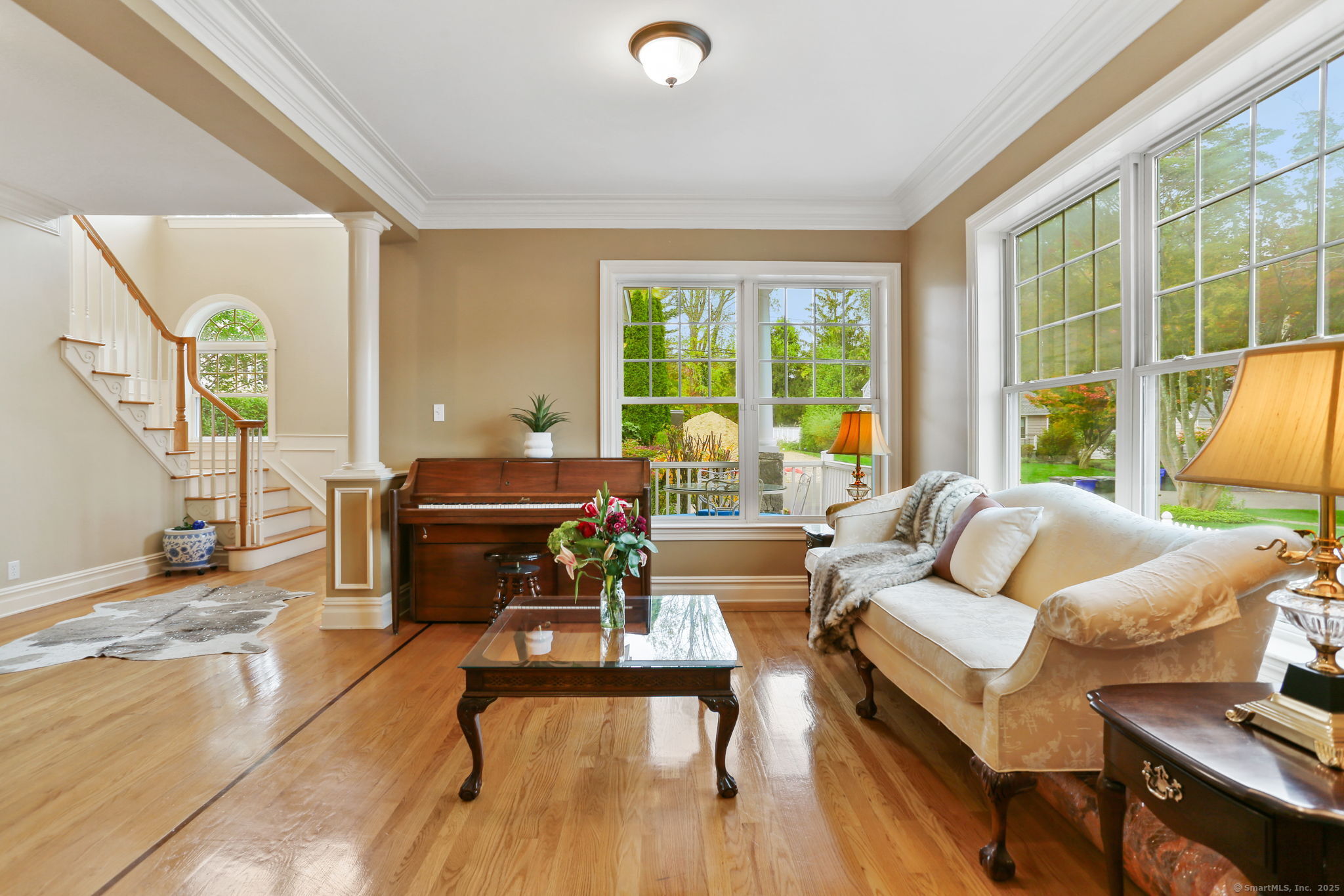 25 Country Road, Unit 25 Fairfield, CT 06824 - Photo 14 of 40 a living room with furniture and a large window